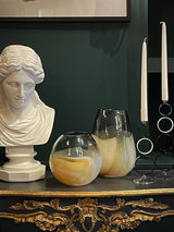 interior-decorated-with-white-busts-and-glass-vases