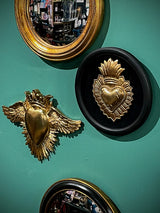 wall-decor-with-mirrors-and-ex-voto-pieces