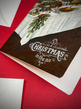 Tarjeta de Navidad 'Merry Christmas in The Air’