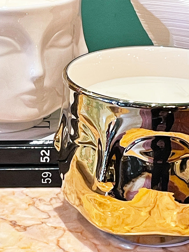 four-faced-ceramic-gold-candles